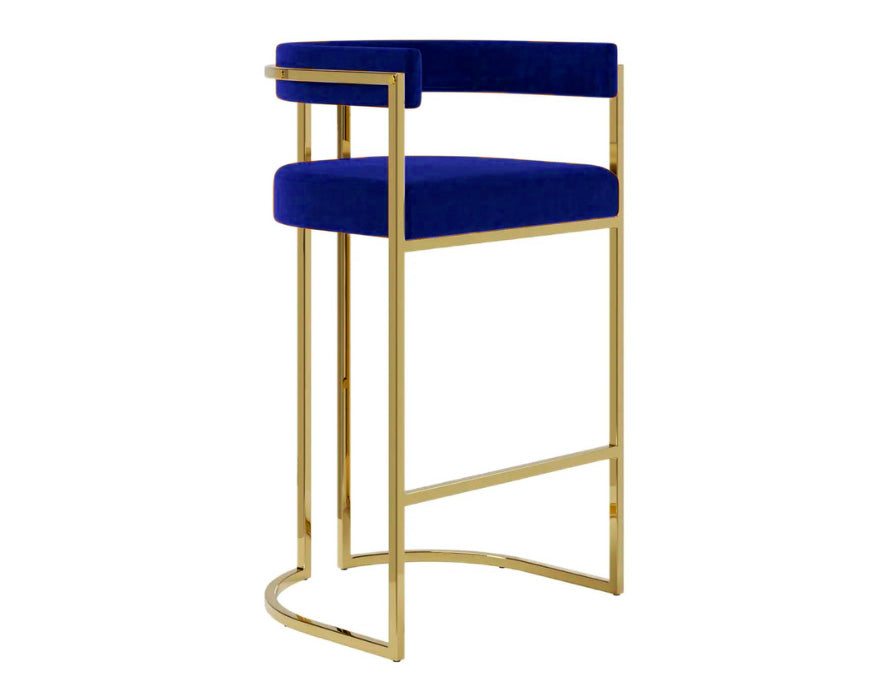 Banqueta de luxo Eldorado com estofado no veludo azul e estrutura dourada em aço inox para bancadas gourmet.