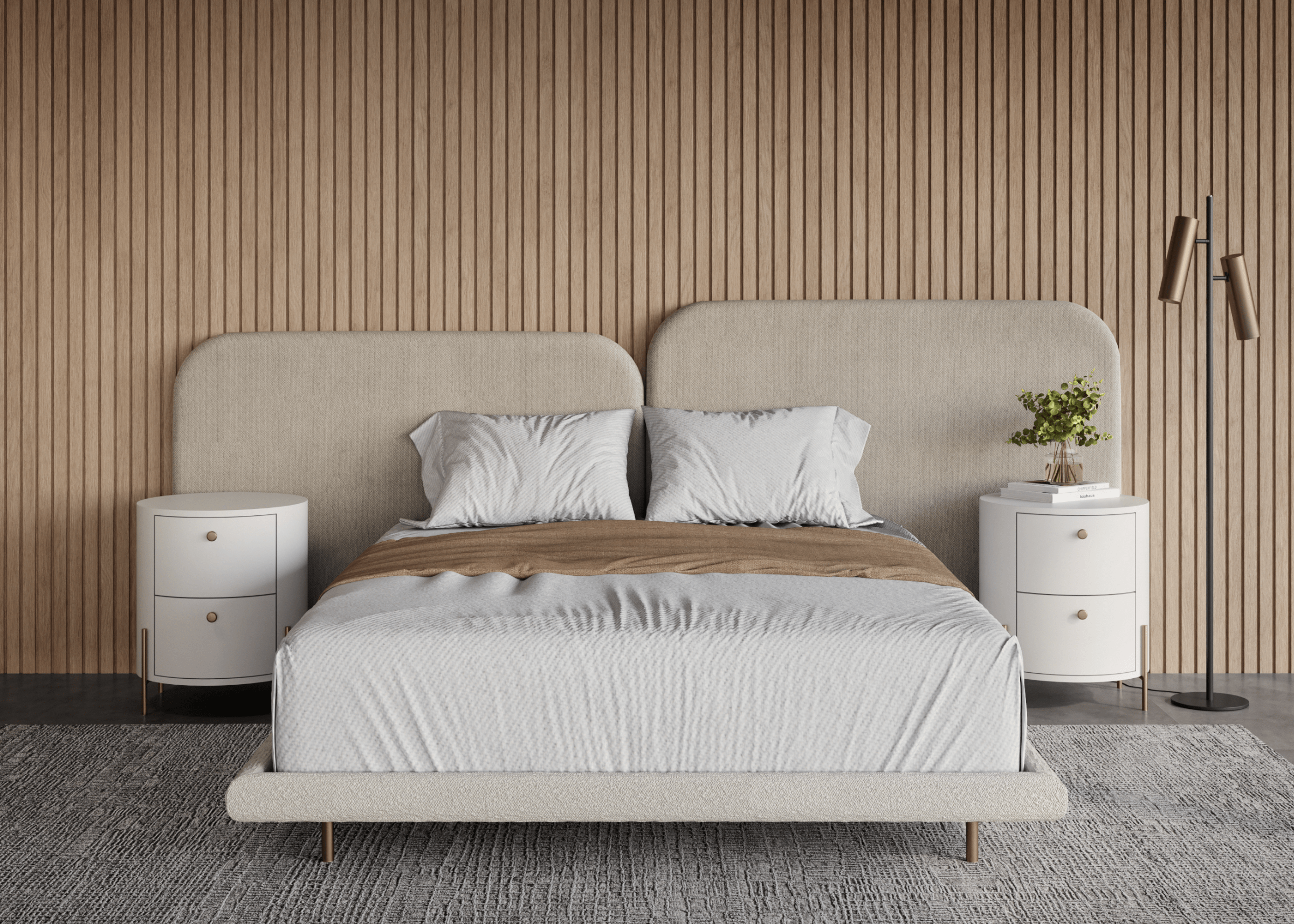 Cama Sonno com base e cabeceira estofadas em tecido bouclê, ambientada. Móvel elegante e acolhedor para dormitórios sofisticados.