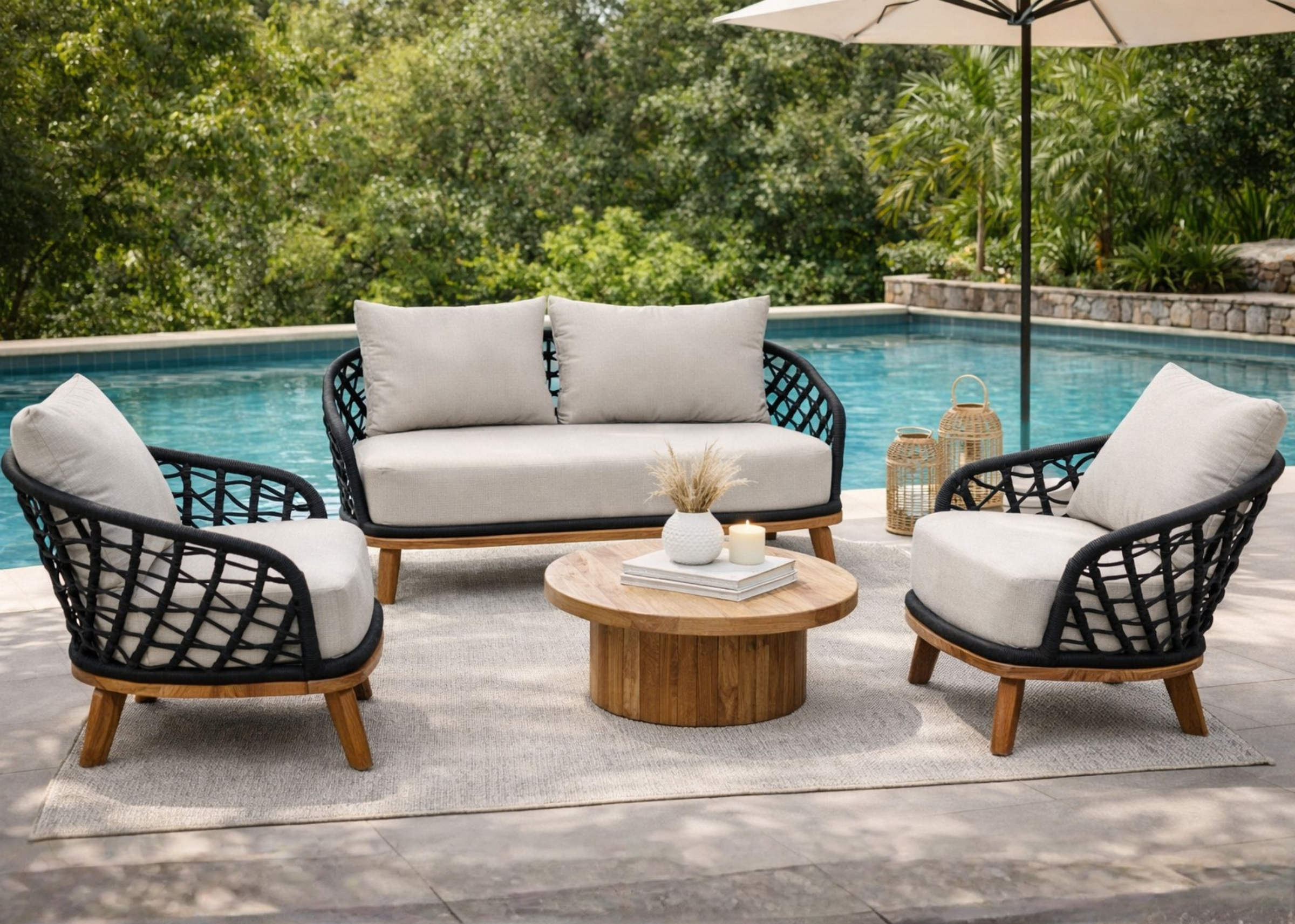 Linha Ventania, sofá e poltrona com base em madeira cumaru e corda náutica preta. Móveis para área externa.
