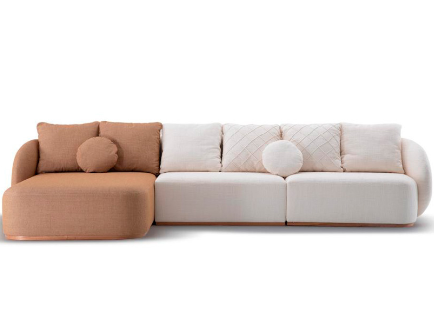 Sofá Lovely: design arredondado e estofamento luxuoso para relaxamento supremo.